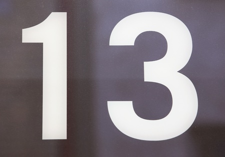 Number 13 on a glass wall の写真素材