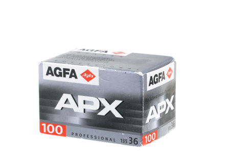 An older film packaging from about 2002, with negative Agfa APX B & W film ISO 100 for 36 exposures. Isolated on white background.のeditorial素材
