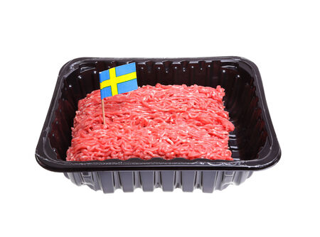 One pack of ground beef decorated with a Swedish flag as an origin label, isolated on white background の写真素材