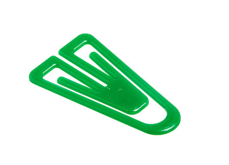One green paper clip isolated on white background の写真素材