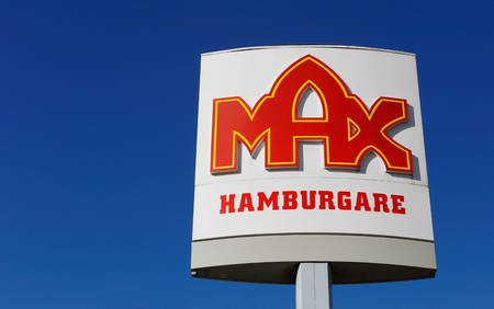 Sign at Max fast food restaurants in Sweden isolated on blue sky.