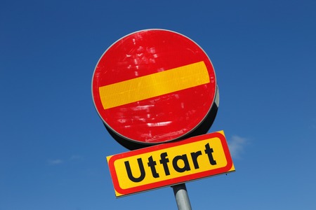 Swedish road sign, Do not enter, with additional panel, Exit  utfart , isolated on blue sky の写真素材