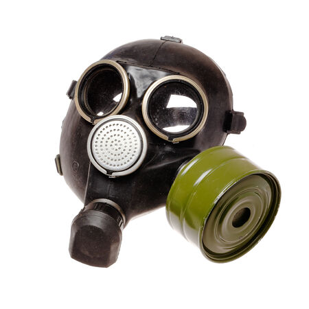 A vintage military gas mask with air filter isolated on whiteの写真素材