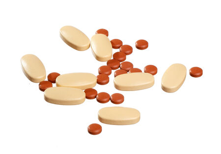 Two different kinds of medicines in tablet form, isolated on white background.の写真素材