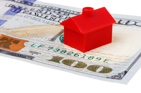 Close-up of red building on a 100 US dollar banknote isolated on white background.の写真素材