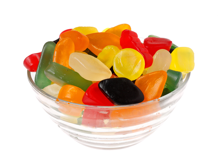 Colorful winegums in a glass bowl isolated on white background.の写真素材