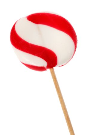 Candy cane lollipop with a wooden stick isolated on white background.の写真素材