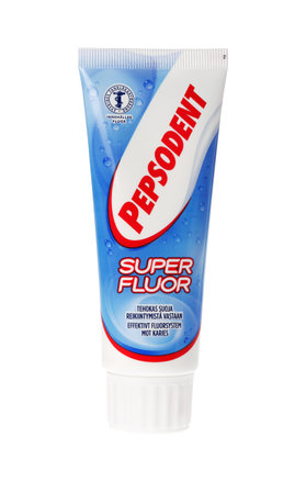 Stockholm, Sweden - March 25, 2015: One tube containing 75 ml Pepsodent super flour of toothpaste for the Swedish market isolated on white.のeditorial素材