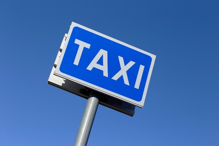 Swedish taxi stand road sign isolatedon blue sky.の写真素材