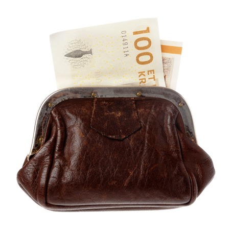 A brown purse with a Danish one hundred kroner bill isolated on white background.の写真素材
