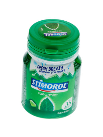 Stockholm, Sweden - August 1, 2015: One green unopend plastic can with sugar free Stimorol spearmint chewing gums isolated on white background.のeditorial素材