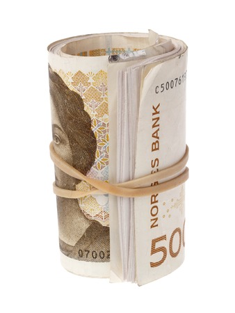 Roll with Norwegian 500 kroner banknotes isolated on white background.の写真素材