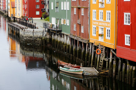 Trondheim, Norway - September 26, 2015: View of old wooden storehouses near by the river Nidelva seen from The Old Town Bridge.のeditorial素材