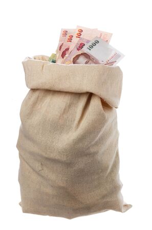 One sack filled with Thai money isolated on white.の写真素材