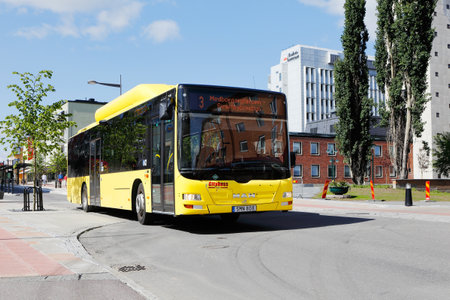 Boden, Sweden - July 13, 2015: A yellow M.A.N city bus at Kungsgatan street in downtown Boden.のeditorial素材