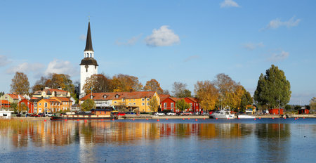Mariefred, Sweden - October 11, 2014: The view of the harbor in Mariefred with the church in the background as seen from the Gripsholm Castle.のeditorial素材