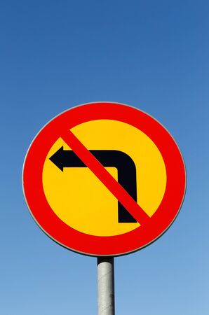 Swedish no left turn road sign on blue sky.の写真素材