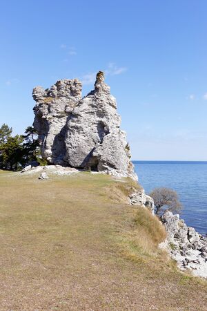 The sea stack named Jungfrun (Virgin) near the village Lickerhamn on Swedish Baltic island Gotland.の写真素材