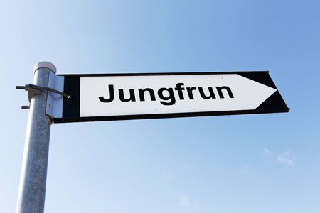 Signpost directing to the sea stack named Jungfrun (Virgin) in Lickerhamn on tre Swedish island Gotland.の写真素材