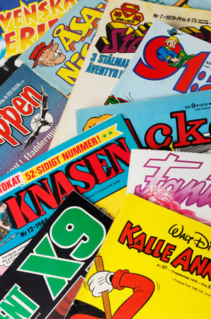 Stockholm, Sweden - August 21, 2016: Collage of Swedish comic books from the 1970s and 1980s, including Archie, Asa Nisse, Batman, the Phantom, 91 Karlsson, Donald Duck, Beetle Bailey, Superman and Agent X9.のeditorial素材
