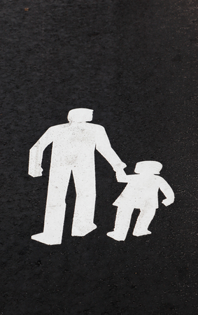 Road markings for a pedestrian walkway painted on the asphalt.の写真素材