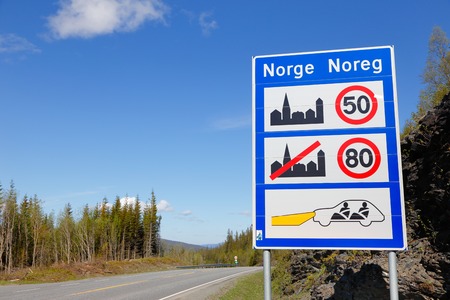Information board on arrival to Norway indicates the speed in and out of villages, and that the...