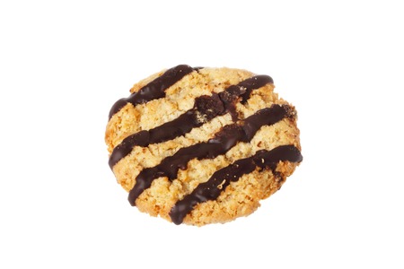 Oat cookie with stripes of chocolate isolated on white background.の写真素材