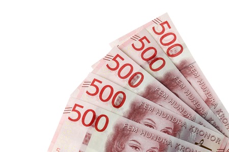Close up of faned out Swedish currency SEK 500 banknotes introduced during the autumn 2016 located in the right bottom corner on white background.の写真素材