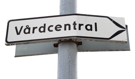 Generic signpost with direction to a Swedish health care center (vardcentral).の写真素材