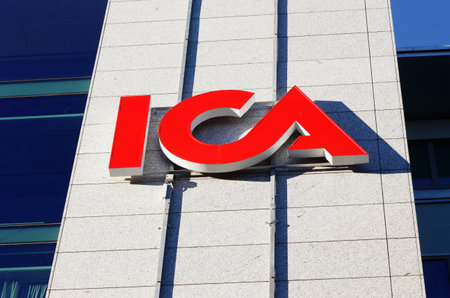 Solna, Sweden - October 6, 2016: The ICA logo at the ICA group headquarters at the street Svetsarvagen.のeditorial素材
