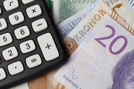 Close up of a calculator on Swedish money.の写真素材