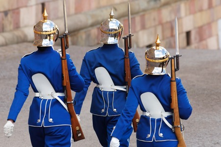 Three soldiers of the Royal guards marching at the Stockholm royal palace.の写真素材