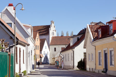 Visby, Sweden - May 12, 2016: People in motion at the street Strandgatan in the Visby old town located in the Swedish province of Gotland.のeditorial素材