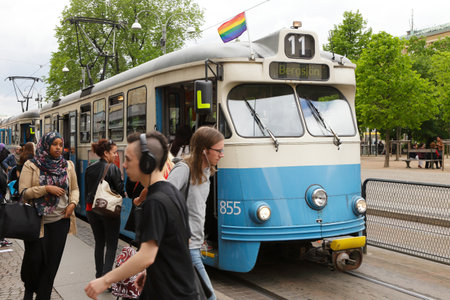 Gothneburg, Sweden - May 28, 2013: Tram on route 11 at stop  decorated with a rainbow flag during the West pride eventのeditorial素材