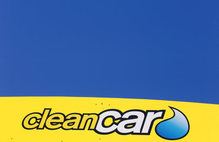 Salem, Sweden - May 29, 2014: Close up of the logo on the side of the roof of the Clean Car unmanned car washes in Sweden for self-service, against a blue sky. This one is located in Salem south of Stockholm.のeditorial素材