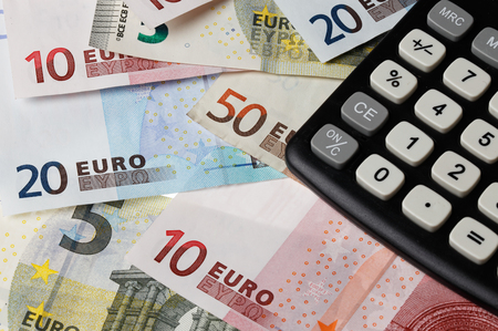 One back calculator on Euro banknotes.の写真素材
