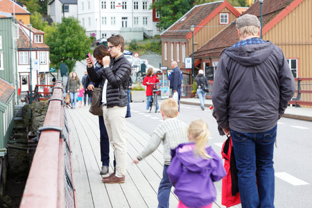 Trondheim, Norway - September 26, 2015:  People on the Old town bridge (Gamle Bybro). The bridge has a length of 82 meters and was constructed in 1861.のeditorial素材