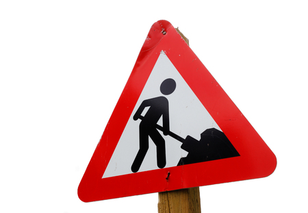 Danish roadwork traffic sign attached a wooden polke isolated on white background.の写真素材