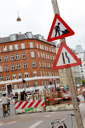 Copenhagen, Denmark - August 24, 2017: Area in Copenhagen city center with construction work in the middle of a street with focus on warning signs.のeditorial素材