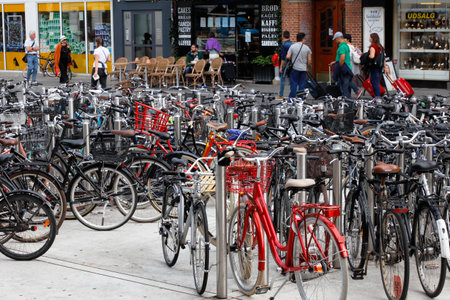 Copenhagen, Denmark - August 24, 2017: Bikes are parked in a bicycle rack at Norreport in downtown Copenhagen.のeditorial素材