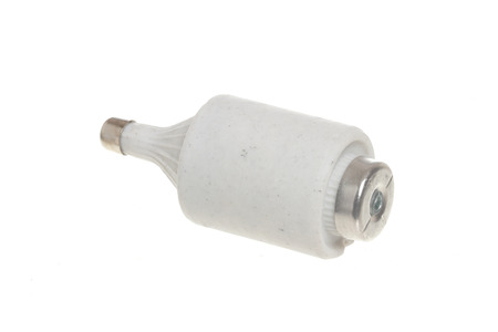 White cermaic electrical fuse 6A and 230V isolated on white background.の写真素材
