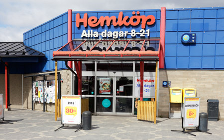 Vagnharad, Sweden - April 22, 2017:  Entrance to the Hemkop grossery shop at the market square.のeditorial素材