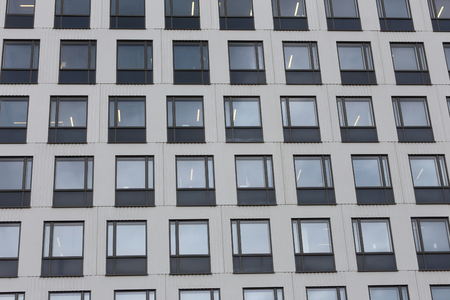 Exterior of an a multi stories office building windows.の写真素材