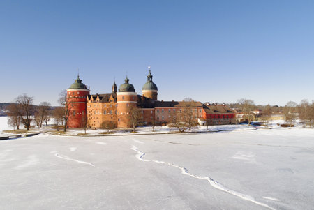 The Swedish Gripsholm castle located in Mariefred in the province of Sodermanland with an ice covered lake in the foreground.のeditorial素材