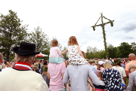Mariefred, Sweden - June 23, 2017: People in all ages celebrates in public midsummer eve holliday event.のeditorial素材