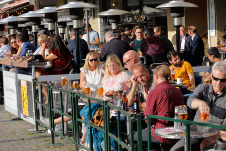 Malmo, Sweden - August 23, 2017: People at the restaurants outdoor seatings located at the square Lilla torg in downtown Malmo.のeditorial素材