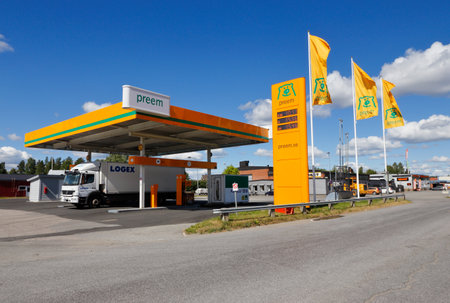Skelleftea, Sweden - June 21, 2018: Preem brand gasoline service station along the high-way road number E4 with one diesel driven truck refuiling.のeditorial素材