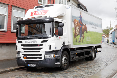 Trondheim, Norway - May 11, 2018: A parked Scania diary delivery truck in service for Tine in the old town district.のeditorial素材