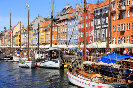 Copenhagen, Denmark - June 27, 2018: View of the Nyhavn harbor district with its colorful buildings.のeditorial素材