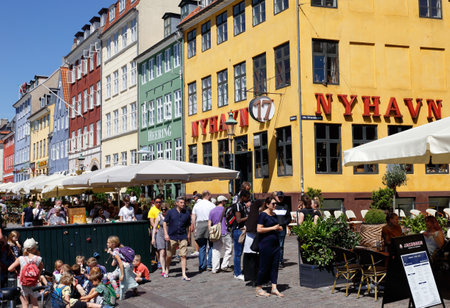 Copenhagen, Denmark - June 27, 2018: People in the Nyhavn district near the hotel and restaurant Nyhavn 17.のeditorial素材